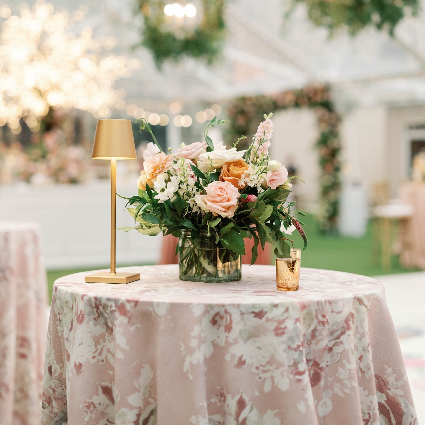 Floral pattern linen rental on a round reception table, Party Central